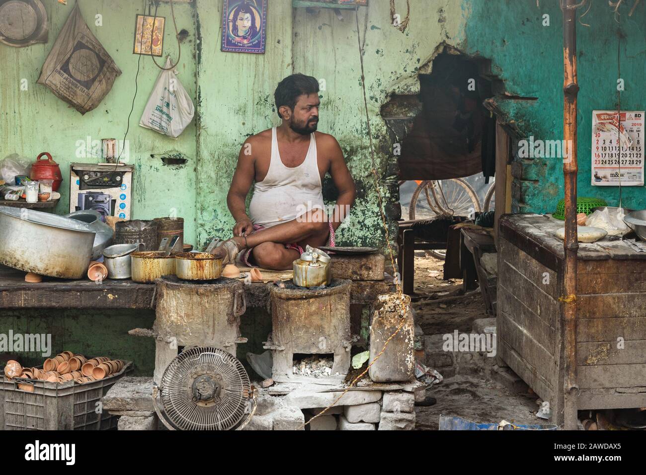 Indian man is selling tea Masala chai on the street in Kolkata. India