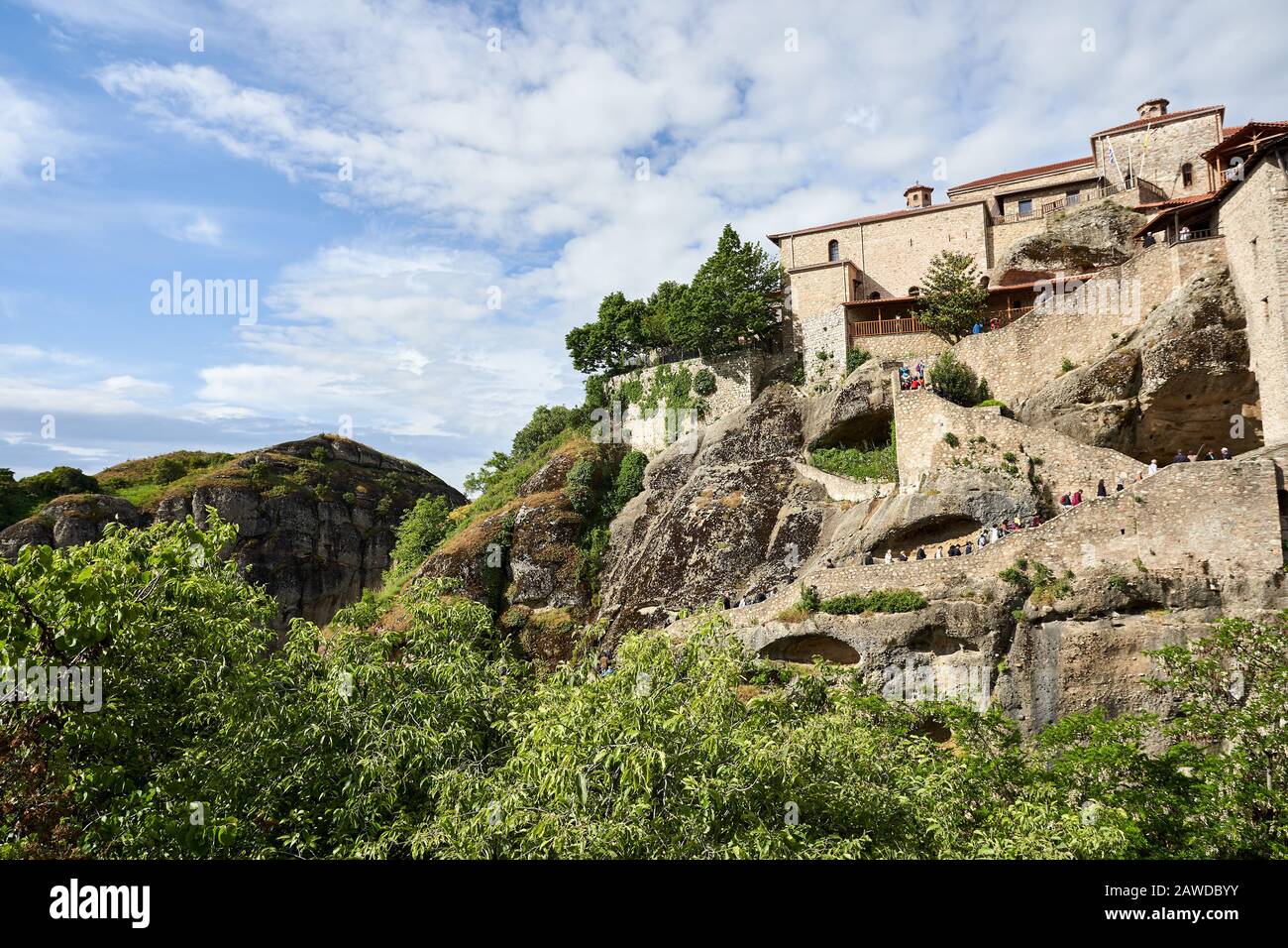 Rock formations of Meteora mountains and the monastery in Greece with blue sky and green forest Stock Photo
