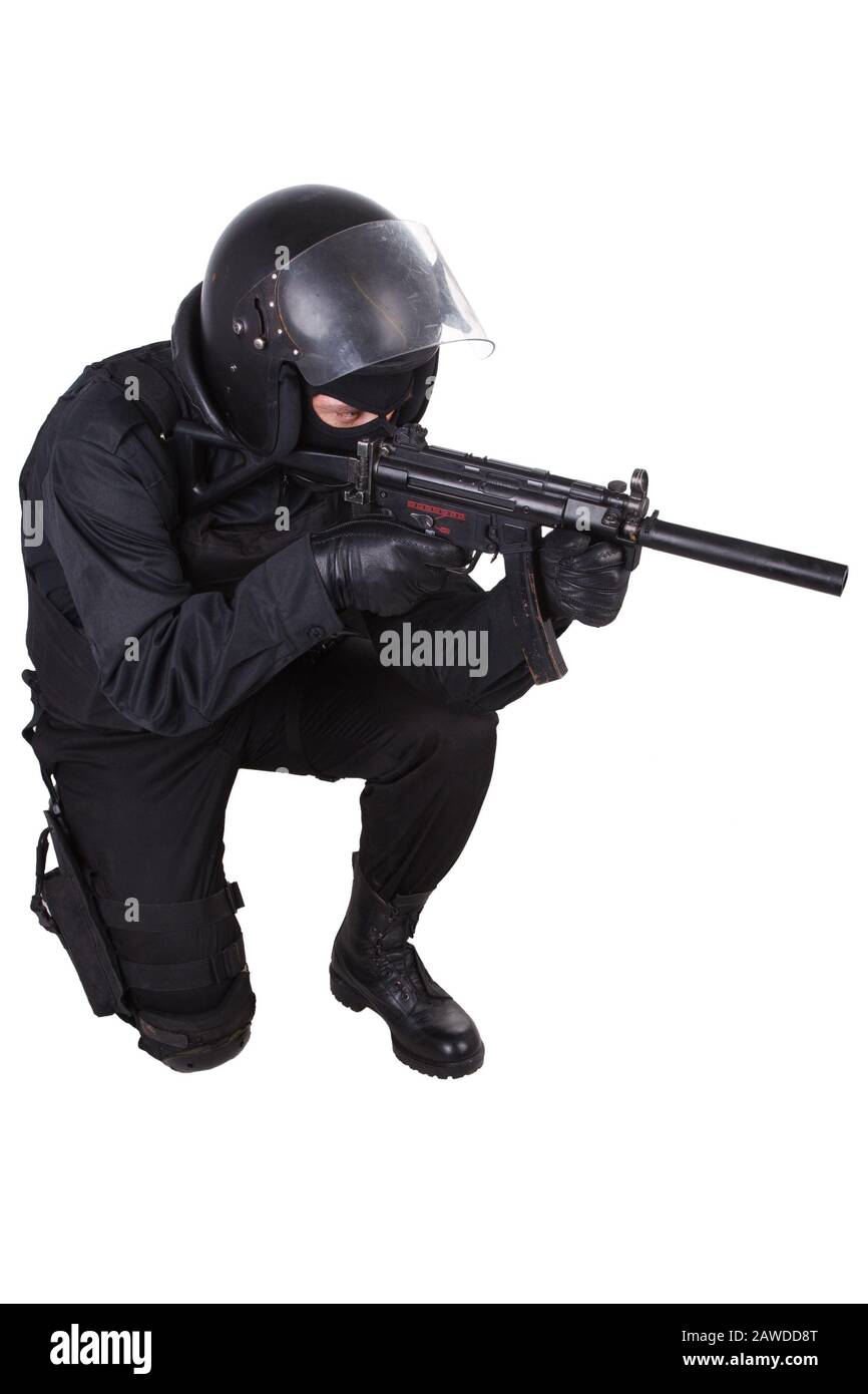 Riot police officer in black uniform with assault rifle isolated on ...