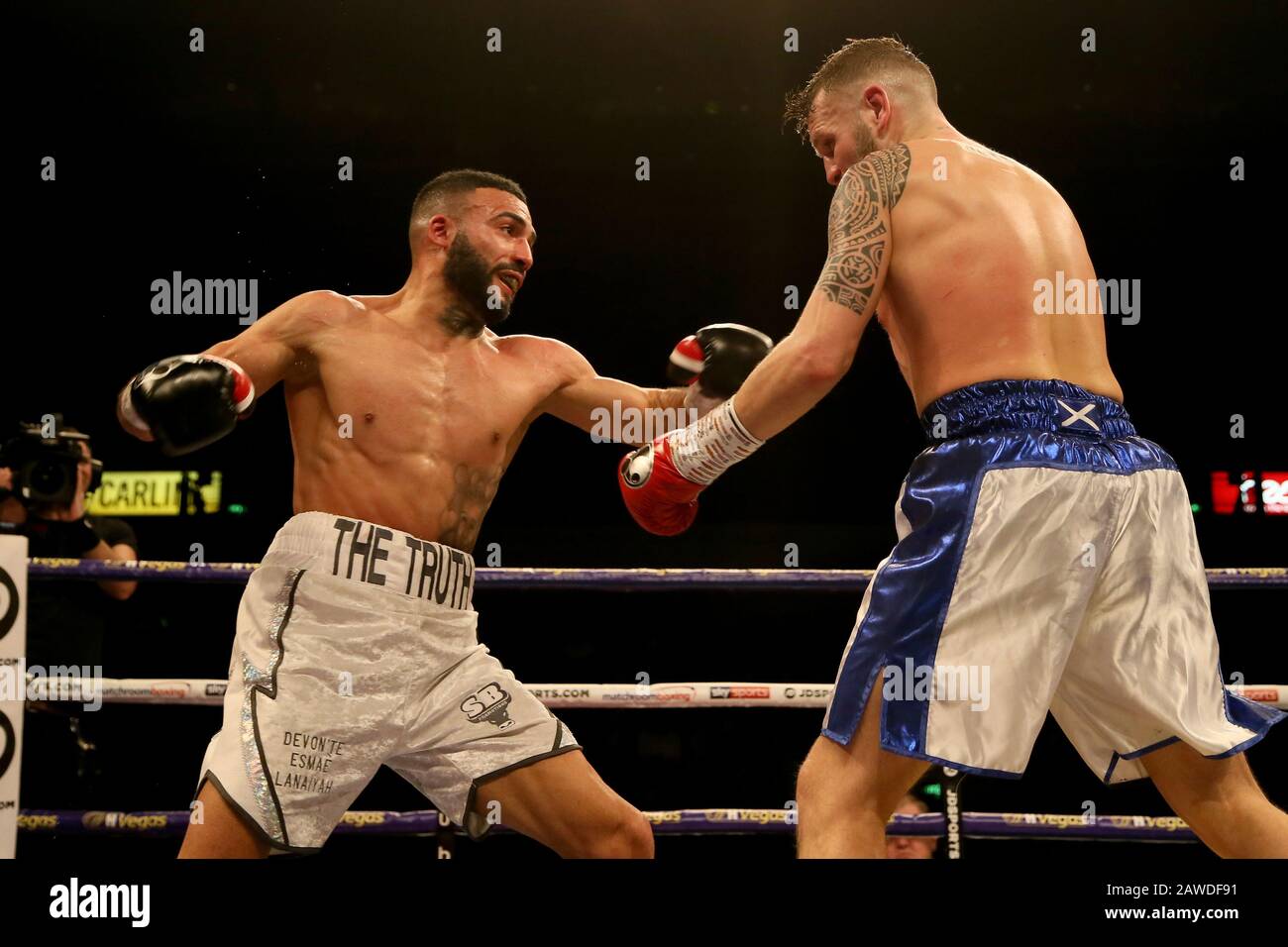 Anthony Tomlinson (left) and Stewart Burt fight in the British & Commonwealth Welterweight Titles eliminator at the FlyDSA Arena, Sheffield. Stock Photo