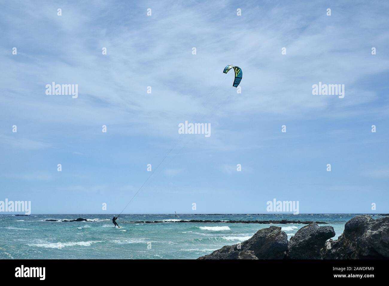 CRETE, GREECE - MAY 19, 2019:  tourists enjoy kite on amazing Elafonissi Beach in Crete island, Greece. Scenic Spot is known for its pink sand beaches Stock Photo