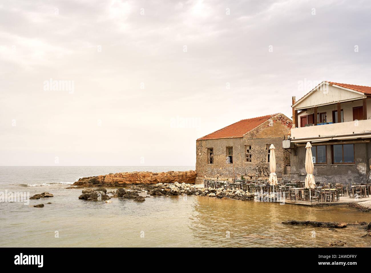 Chania, Crete, Greece. May 20, 2019. Restaurant along the shore of The Venetian Harbour in Chania western Crete in summer. Stock Photo