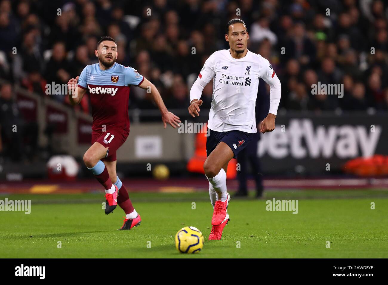 Virgil van Dijk of Liverpool and Robert Snodgrass of West Ham United in  action during the Premier League match between West Ham United and  Liverpool at London Stadium.(Final Score; West Ham United