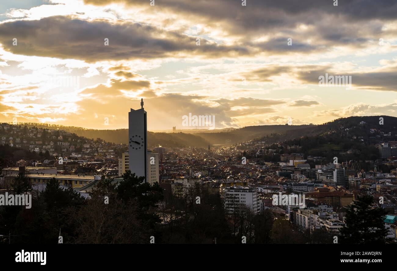 Germany, Stuttgart, Warm orange sunset sunlight and sunbeams shining on ...