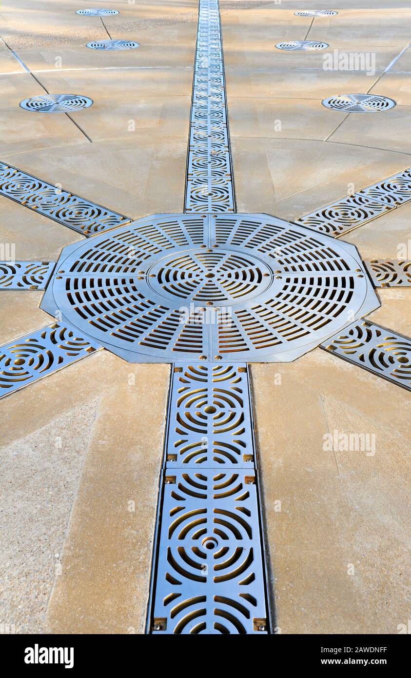 Decorative Steel Grate Covers on Large Patio Stock Photo