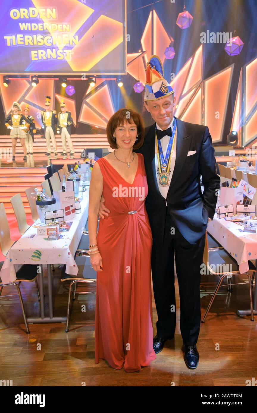 Aachen, Germany. 08th Feb, 2020. Friedrich Merz, CDU politician, and his wife Charlotte Merz are standing in the hall when the Order against the Tierische Ernst 2020 of the Aachen Carnival Association (AKV) is awarded. Credit: Henning Kaiser/dpa/Alamy Live News Stock Photo