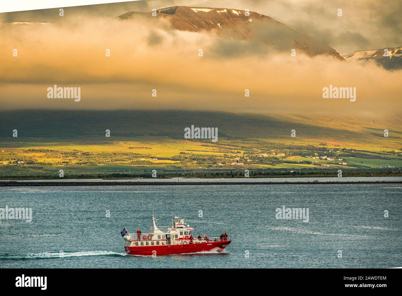 Whale Watching Boat Passing The Mountains At Akureyri, Iceland Stock Photo