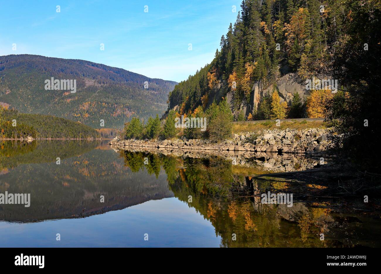 Lake reflecting an autumn forest along the Nass River Valley between Terrace and Gitlaxt'aamiks Stock Photo