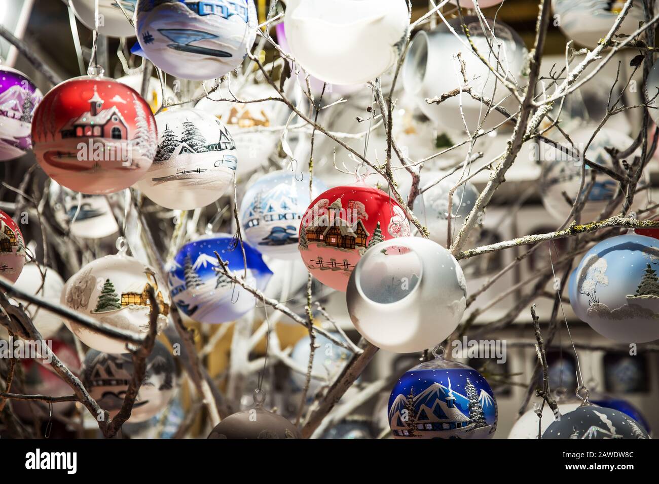 Christmas toys and bauble hanging in shop on Christmas market . Stock Photo