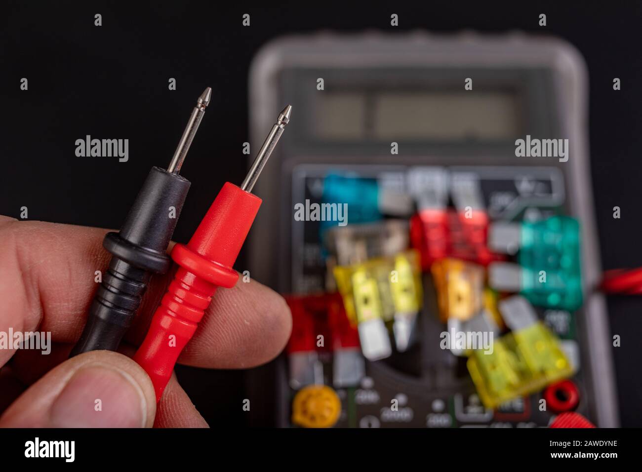 Measurement of resistance of car fuses with an electric meter. Checking