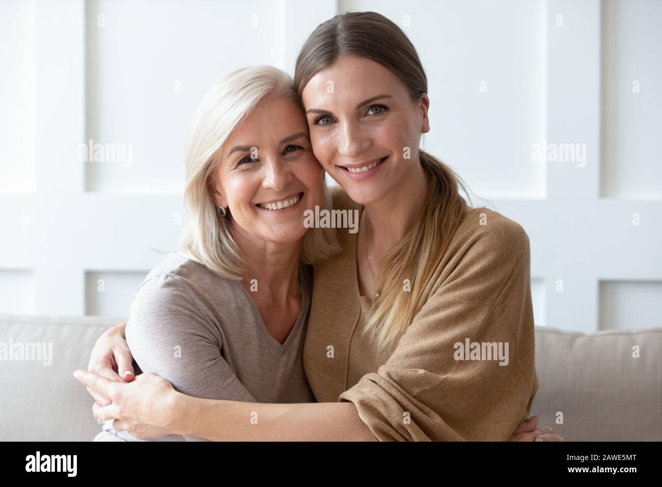 Headshot portrait of mature mom and adult daughter posing Stock Photo