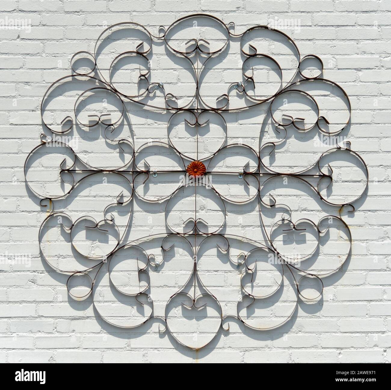 Decorative Wrought Iron on a Painted White Brick Wall Stock Photo Alamy