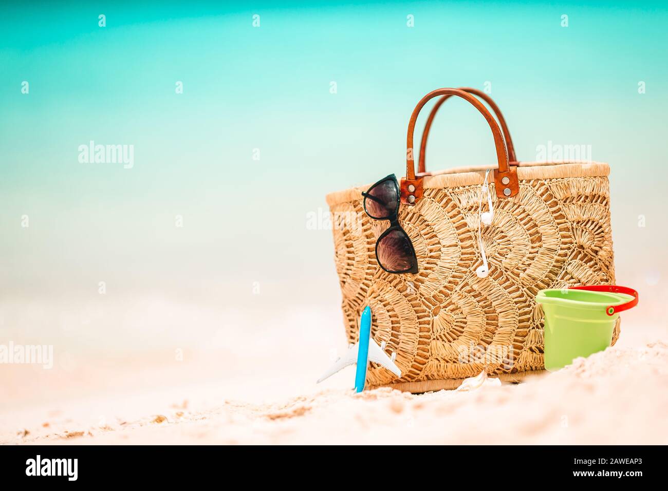 Beach accessories straw bag, hat and unglasses on the beach Stock