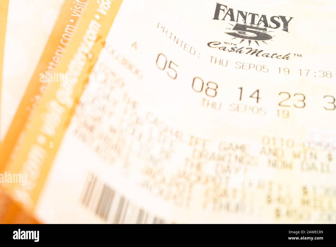 Vidalia, Georgia / USA - September 9, 2019: A close-up studio shot of the Georgia Fantasy 5 yellow lottery printout ticket. Stock Photo