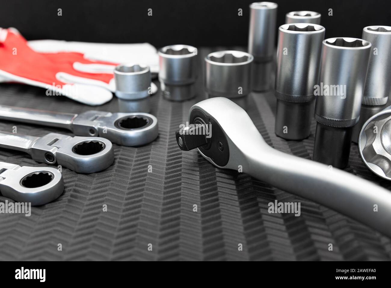 Car repair tools, wrench tool set on a black texture background Stock Photo