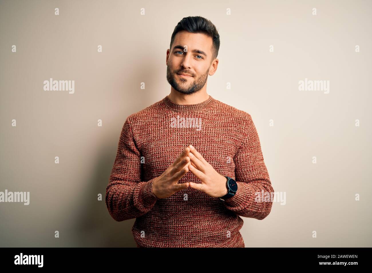 Young Handsome Man Wearing Casual Sweater Standing Over Isolated