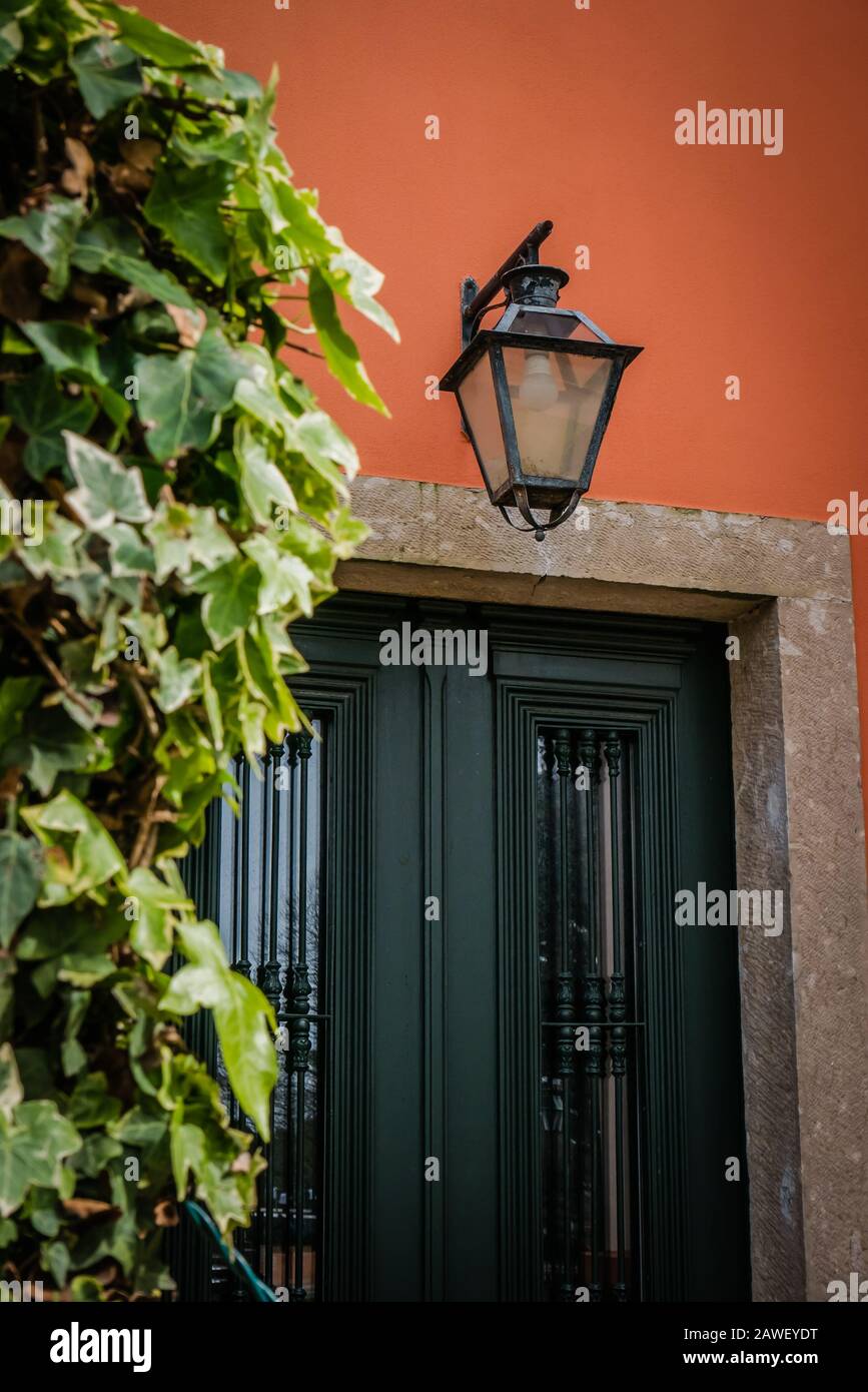 traditional portuguese house with a light orange colored wall Stock