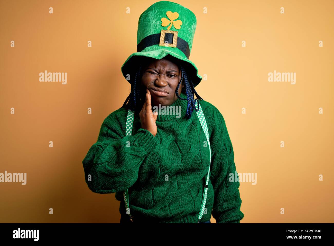 Plus size african american woman with braids wearing green hat