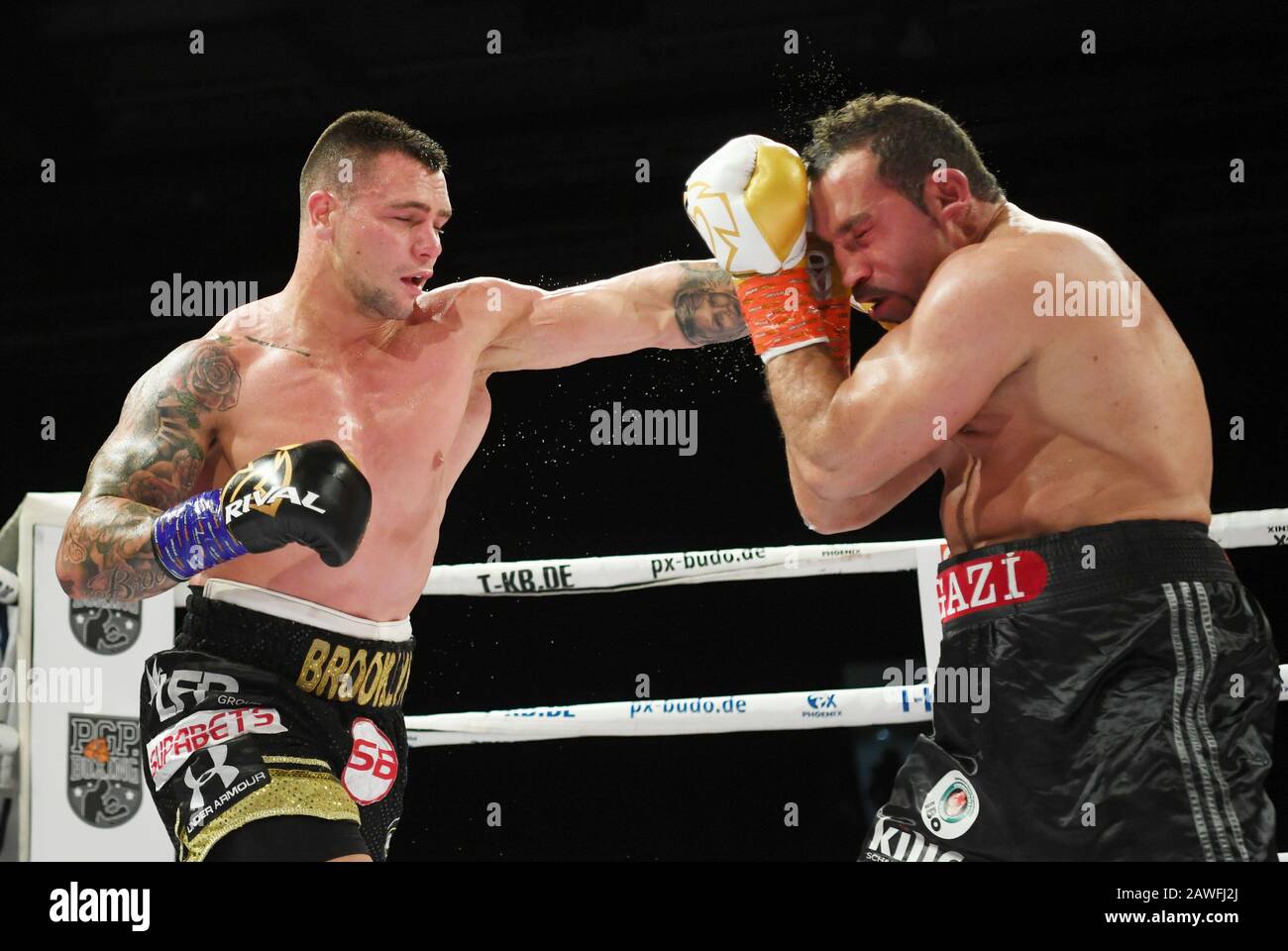 Göppingen, Germany. 08 February 2020, Baden-Wuerttemberg, Göppingen: Boxing, professionals: IBO World Championship, Cruiserweight, Arslan (Germany) - Lerena (South Africa) in the EWS Arena. Firat Arslan (r) from Germany fights against Kevin Lerena (l) from South Africa. Photo: Marijan Murat/dpa Credit: dpa picture alliance/Alamy Live News Stock Photo