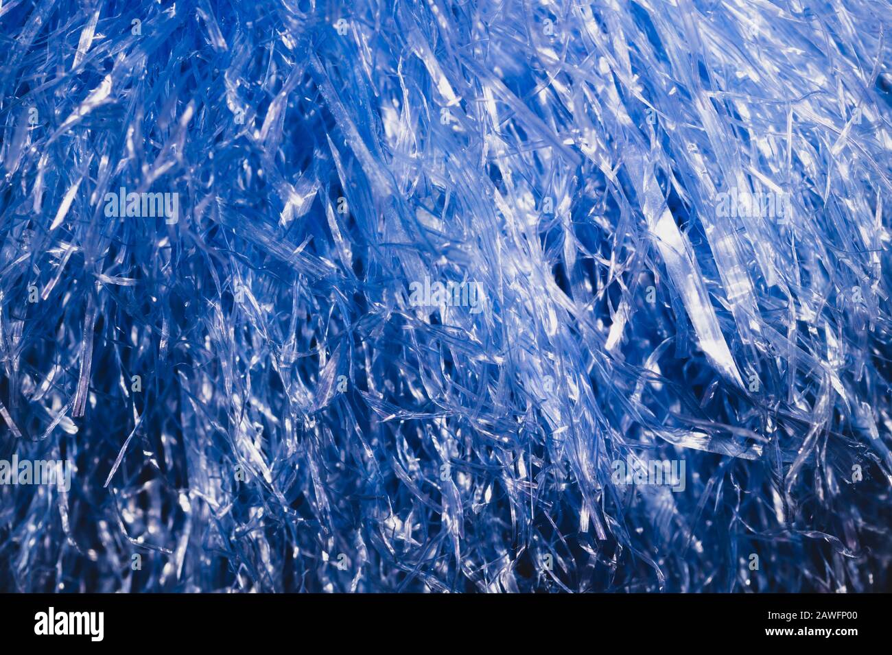 Abstract blue texture with wavy plastic stripes. blue tinsel macro Stock Photo