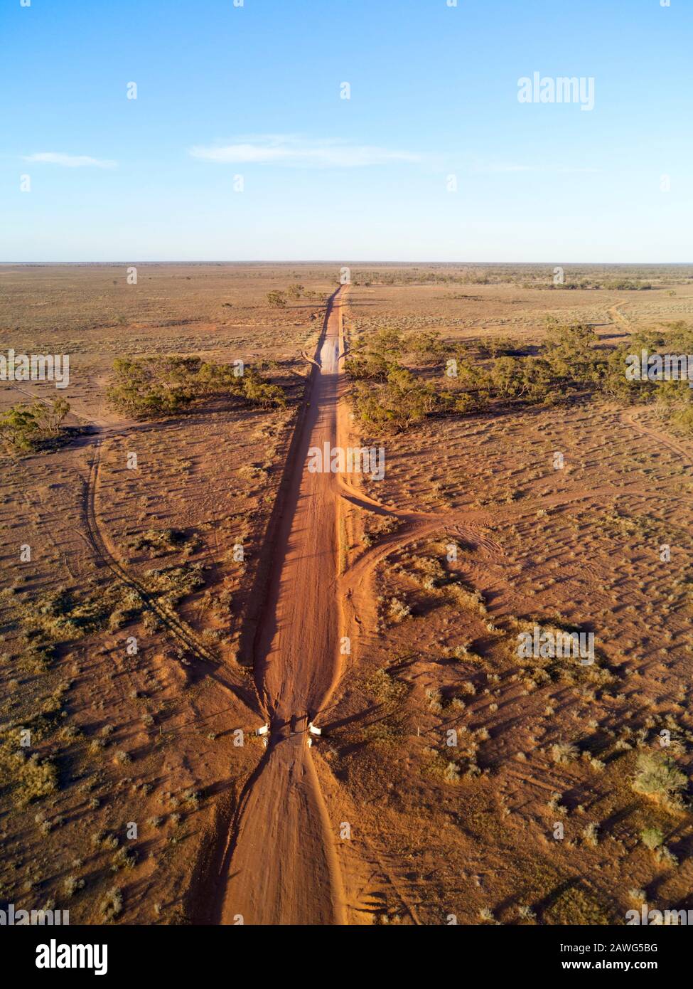 Aerial of red dirt unsealed road as it passes through the flood plains of the Darling River near Mount Murchison outback New South Wales Australia Stock Photo
