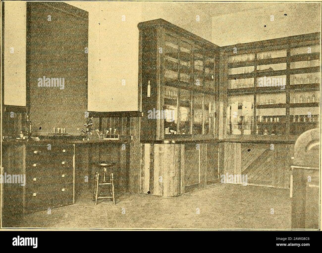 Annual report of the Storrs Agricultural Experiment Station, Storrs, Conn . Fig. 3. Cold Storage Chamber of Dairy Bacteriology Laboratory.. Fig. 4.Storage Shelves for Glassware in Dairy Bacteriology Laboratory. 26 STORRS AGRICULTURAL EXPERIMENT STATION. Room No. 3. Sections of this room can be seen in Figs. 3and 4. This room is practically the same size as No. 1 andis fitted with glass cases in which glassware may be storedaway from the dust. This room is separated from room No. 1and can be kept quite cool; and it is in this room that most ofthe real investigation work is done. Standing on the Stock Photo