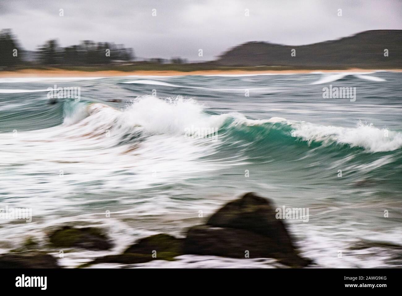 Palm Beach, NSW, Australia. 9th Feb, 2020. Waves break. A coastal trough off the NSW coast is being monitored for East Coast Low development over the next 24 hours. This system will move only slowly southwards and bring increasingly widespread and prolonged periods of rain to the hunter and southern NSW coast. High tides forecast on Sunday through to Tuesday may exacerbate flood conditions in low lying coastal areas. A Severe Weather Warning has been issued for the Metropolitan, Illawarra, South Coast and parts of Northern Rivers, Mid North Coast, Hunter, Central Tablelands, Southern Tableland Stock Photo