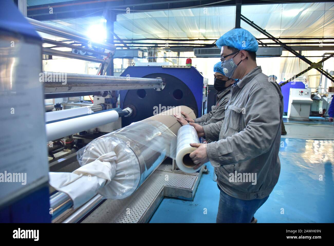 Hebei, Hebei, China. 7th Feb, 2020. Hebei, CHINA-Workers speed up the production of PE breathable membranes for medical use in the embossing workshop of Xinle plastic film co., LTD., Shijiazhuang, Hebei province, Feb. 7, 2020.To help combat the pneumonia epidemic caused by the new coronavirus, the company's embossing workshop, which produces PE breathable membranes for medical use, operates around the clock to ensure supplies of raw materials to downstream isolation garment manufacturers. Credit: SIPA Asia/ZUMA Wire/Alamy Live News Stock Photo