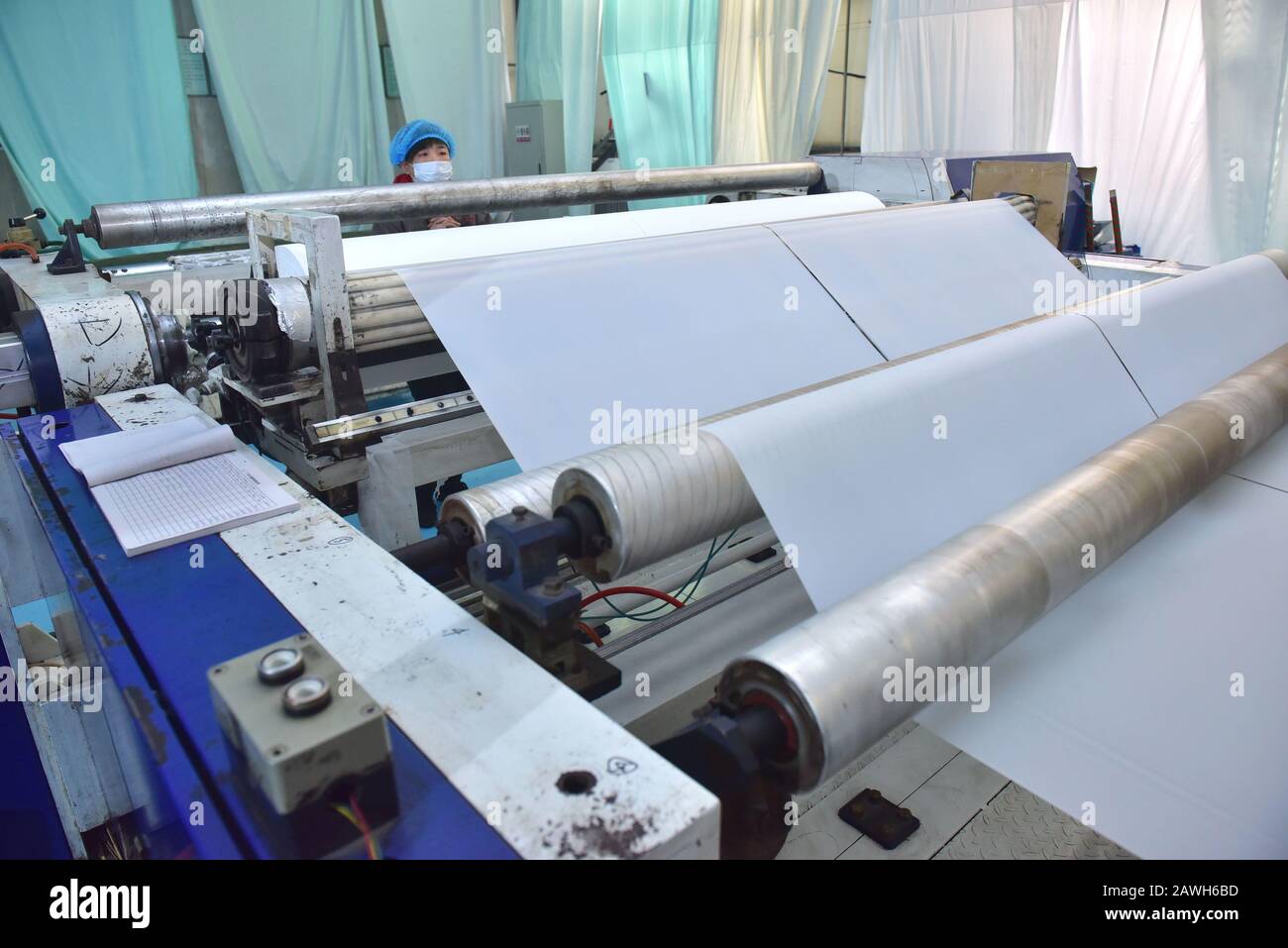 Hebei, Hebei, China. 7th Feb, 2020. Hebei, CHINA-Workers speed up the production of PE breathable membranes for medical use in the embossing workshop of Xinle plastic film co., LTD., Shijiazhuang, Hebei province, Feb. 7, 2020.To help combat the pneumonia epidemic caused by the new coronavirus, the company's embossing workshop, which produces PE breathable membranes for medical use, operates around the clock to ensure supplies of raw materials to downstream isolation garment manufacturers. Credit: SIPA Asia/ZUMA Wire/Alamy Live News Stock Photo