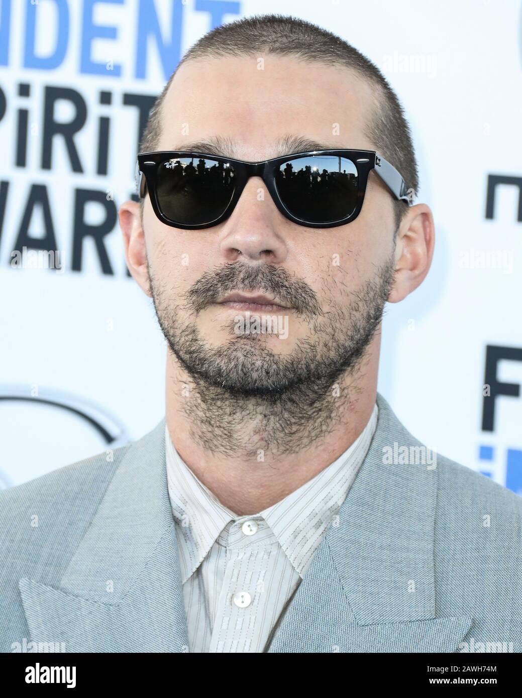 SANTA MONICA, LOS ANGELES, CALIFORNIA, USA - FEBRUARY 08: Actor Shia  LaBeouf wearing Gucci with Ray-Ban sunglasses arrives at the 2020 Film  Independent Spirit Awards held at the Santa Monica Beach on