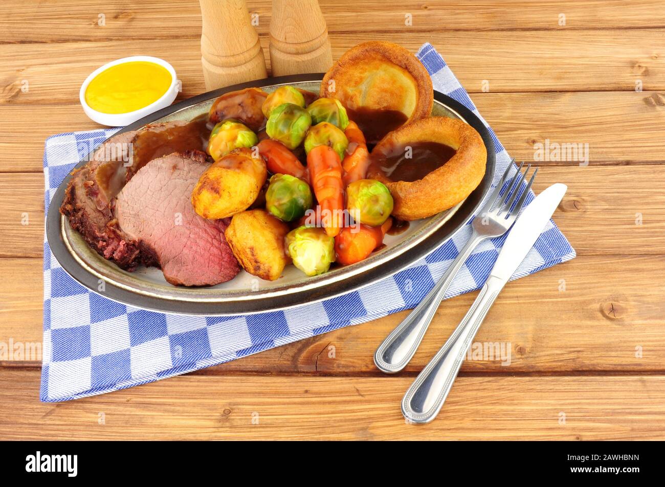 Yorkshire puddings with roast beef and gravy hires stock photography