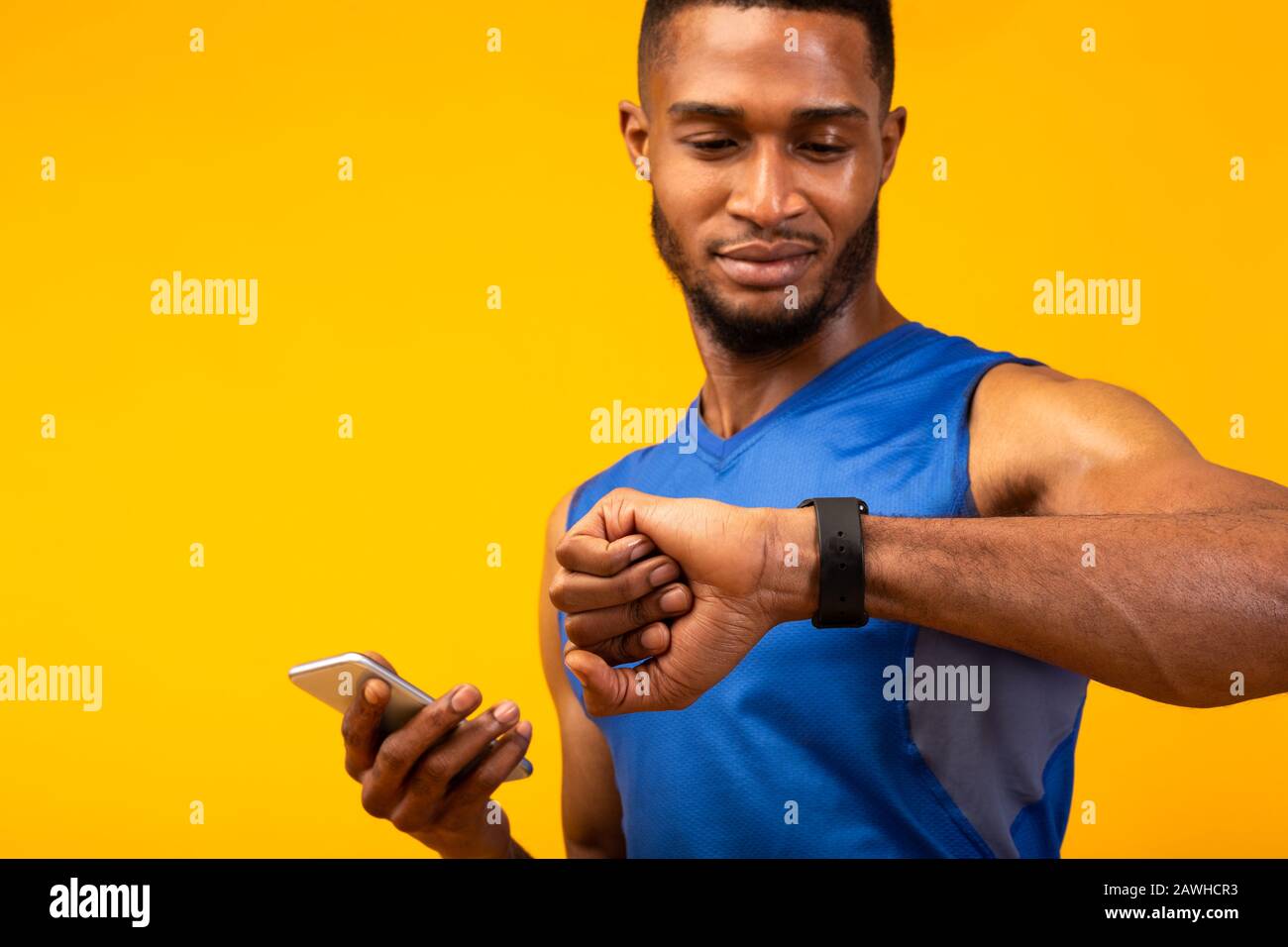 Headshot of black guy looking at watch Stock Photo Alamy
