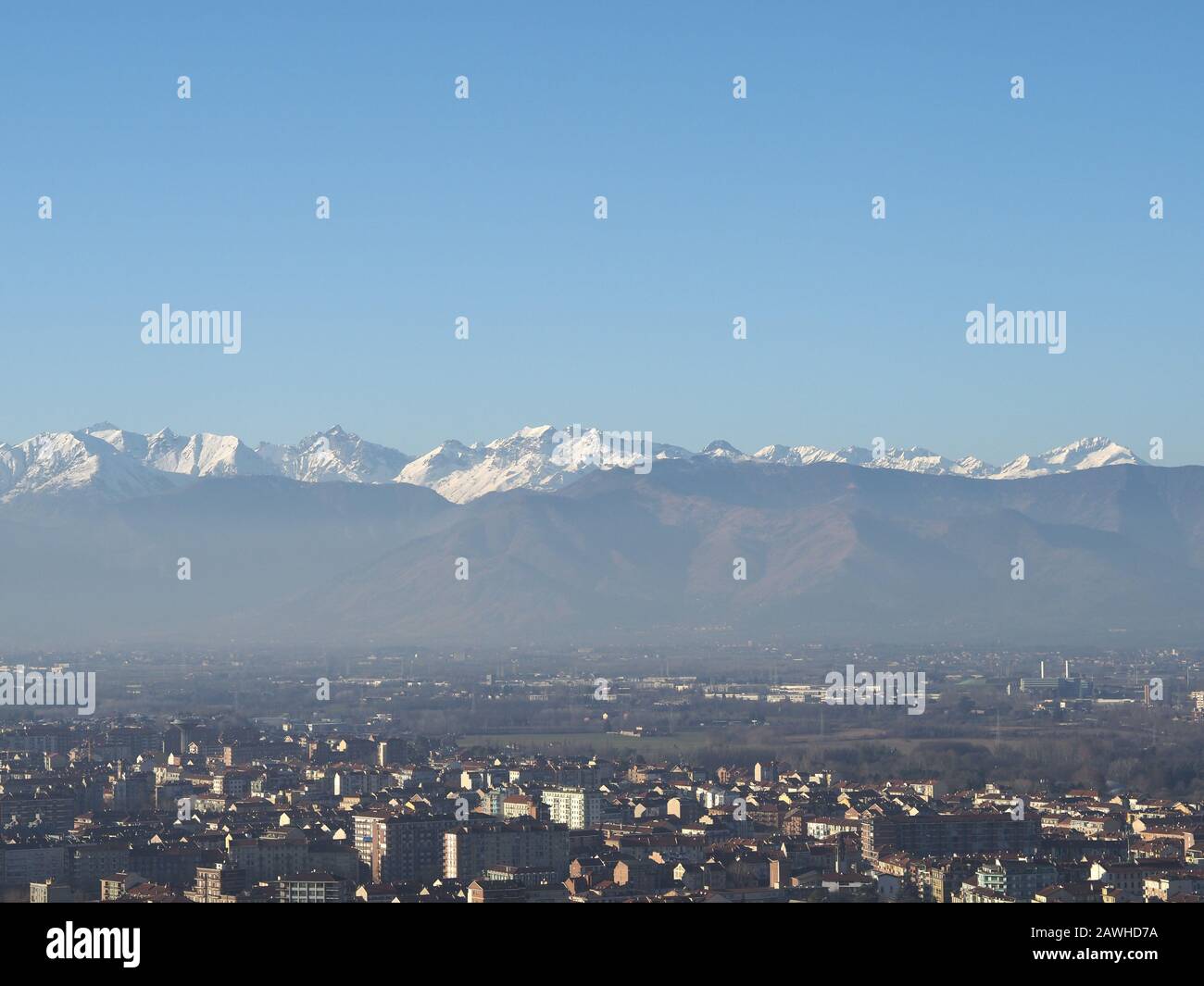 Aerial view of the city of Turin, Italy with Alps mountain range in the ...