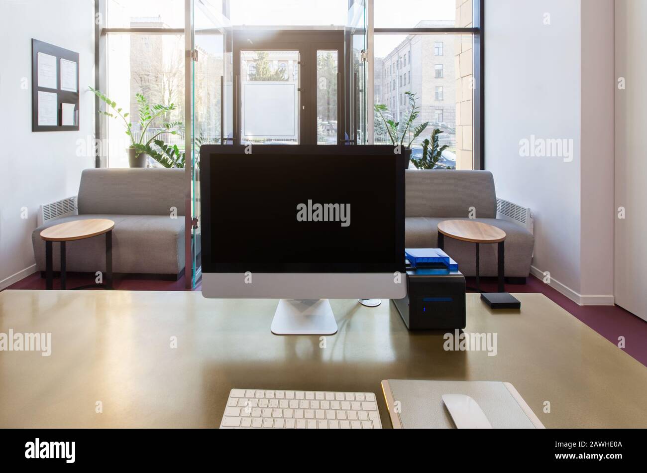 Reception desk with computer and black blank screen Stock Photo