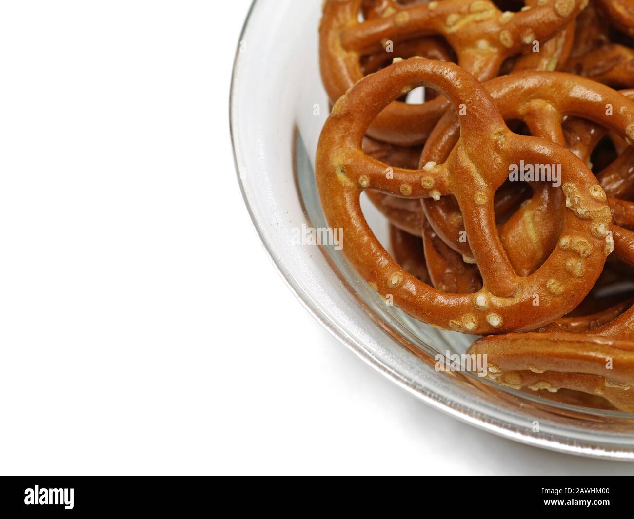 Closeup of bowl with baked pretzels isolated on white background with copy space Stock Photo
