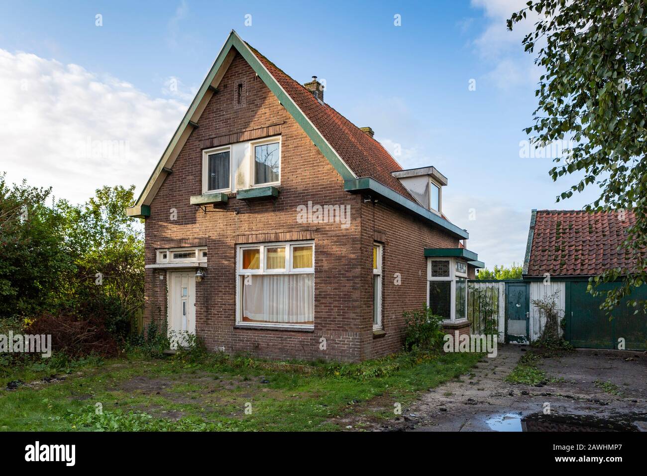 Small isolated and abandoned single family house in Lisse the netherlands. Stock Photo