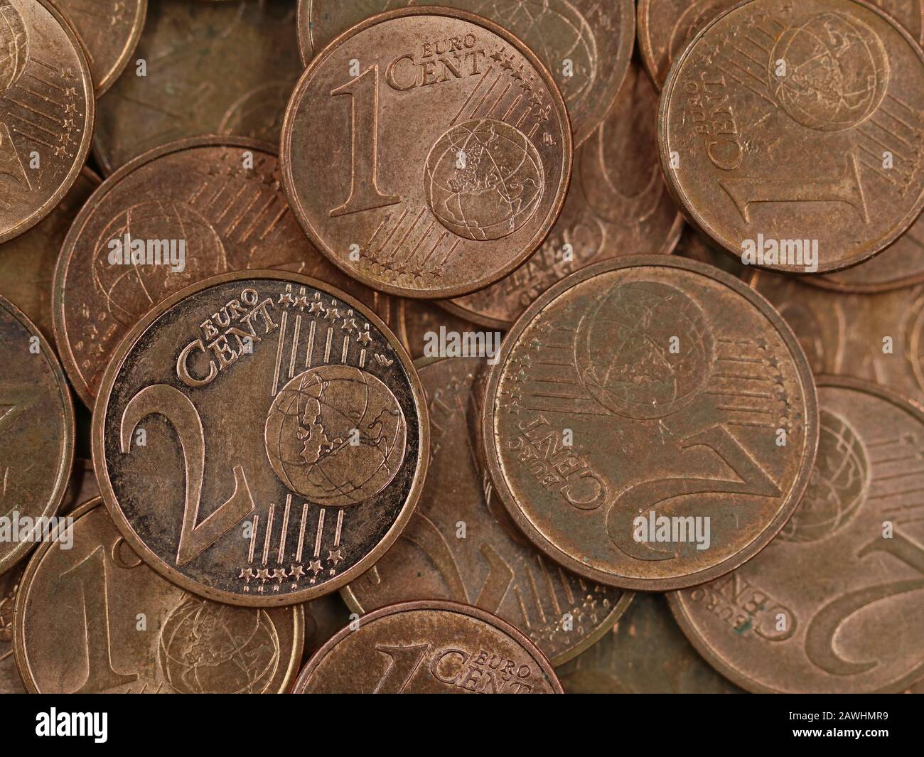 close up of old used one and two euro cent coins background, end of small change or cash Stock Photo