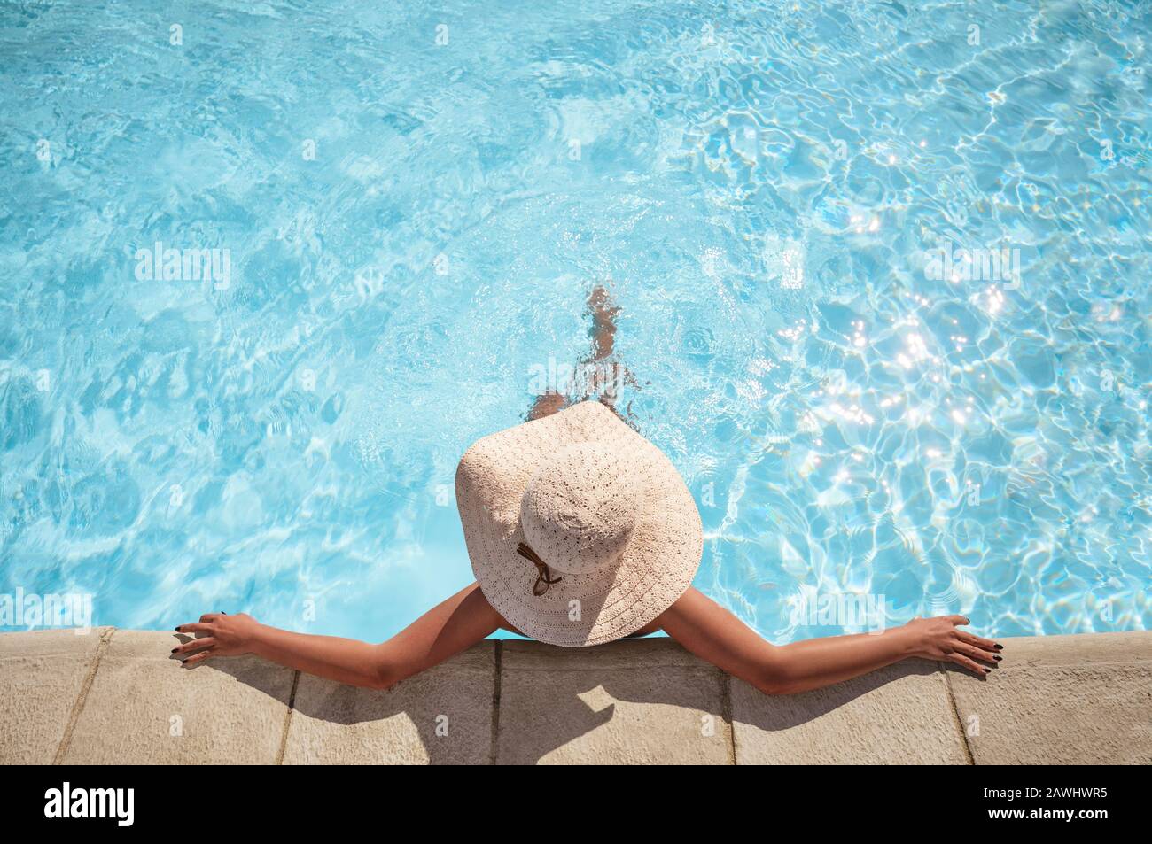Young woman relaxing in the swimming pool with copy space Stock Photo ...