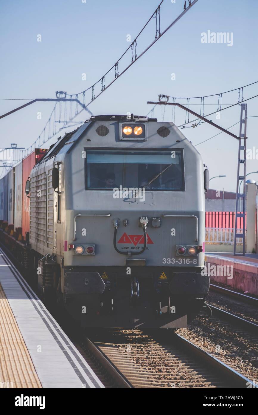 Alcala de Henares train station, Madrid province, Spain; Feb/25/2019; Cargo train passing by the station of Alcala de Henares, Madrid province, Spain Stock Photo