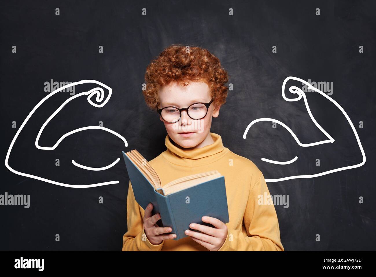 Smart kid student wearing glasses holding book on black Stock Photo