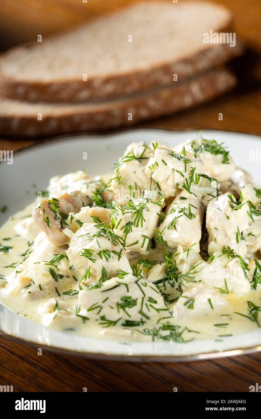 Stew made from chicken meat, cream and mushrooms Stock Photo