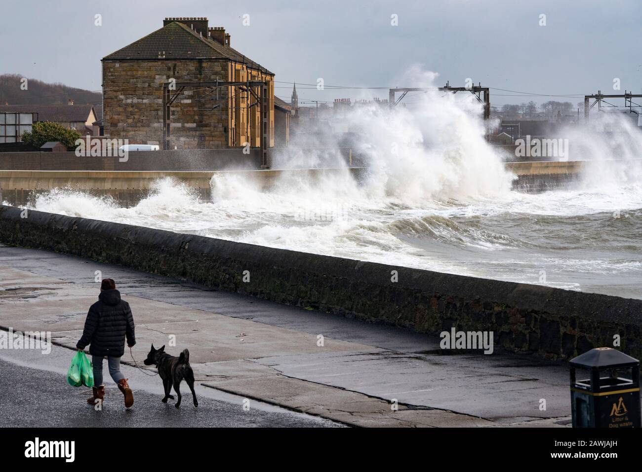 Saltcoats, Scotland, UK. 9 February, 2020.  Storm Ciara creates large waves breaking over seawall at Saltcoats in Ayrshire. Train services on the adjacent railway have been interrupted. With high tide due at midday and winds expected to increase in speed later in the day, the height of the waves are expected to dramatically increase Iain Masterton/Alamy Live News. Stock Photo