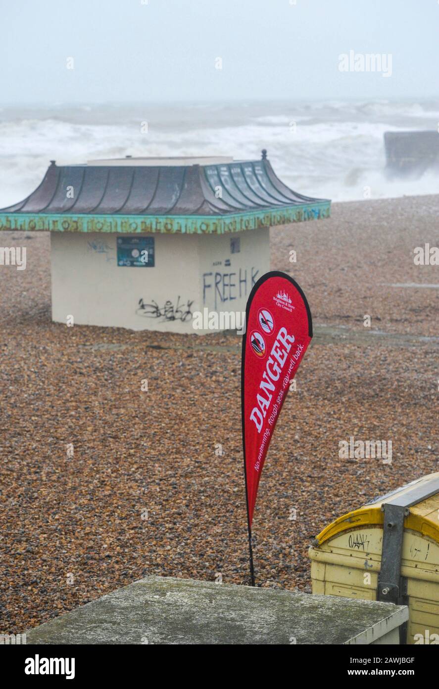 Brighton UK 9th February 2020 - A Danger sign on Brighton beach as Storm Ciara hits Britain with amber warnings being given throughout the country as high winds are expected to cause damage and possible danger to life: Credit Simon Dack / Alamy Live News Stock Photo