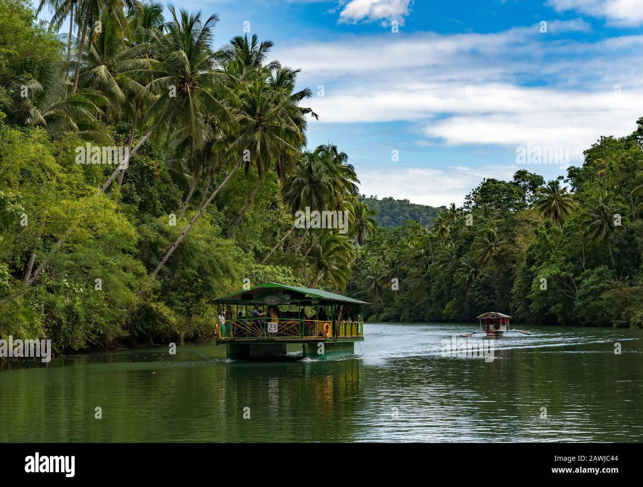 Cruise ship on the  Loboc River is a river in the Bohol province of the Philippines. It is one of the major tourist destinations of Bohol. Stock Photo