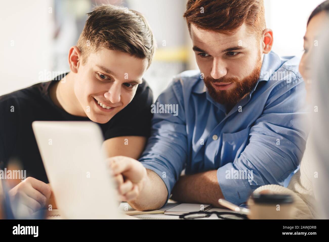 Smart student helping his classmate with homework Stock Photo