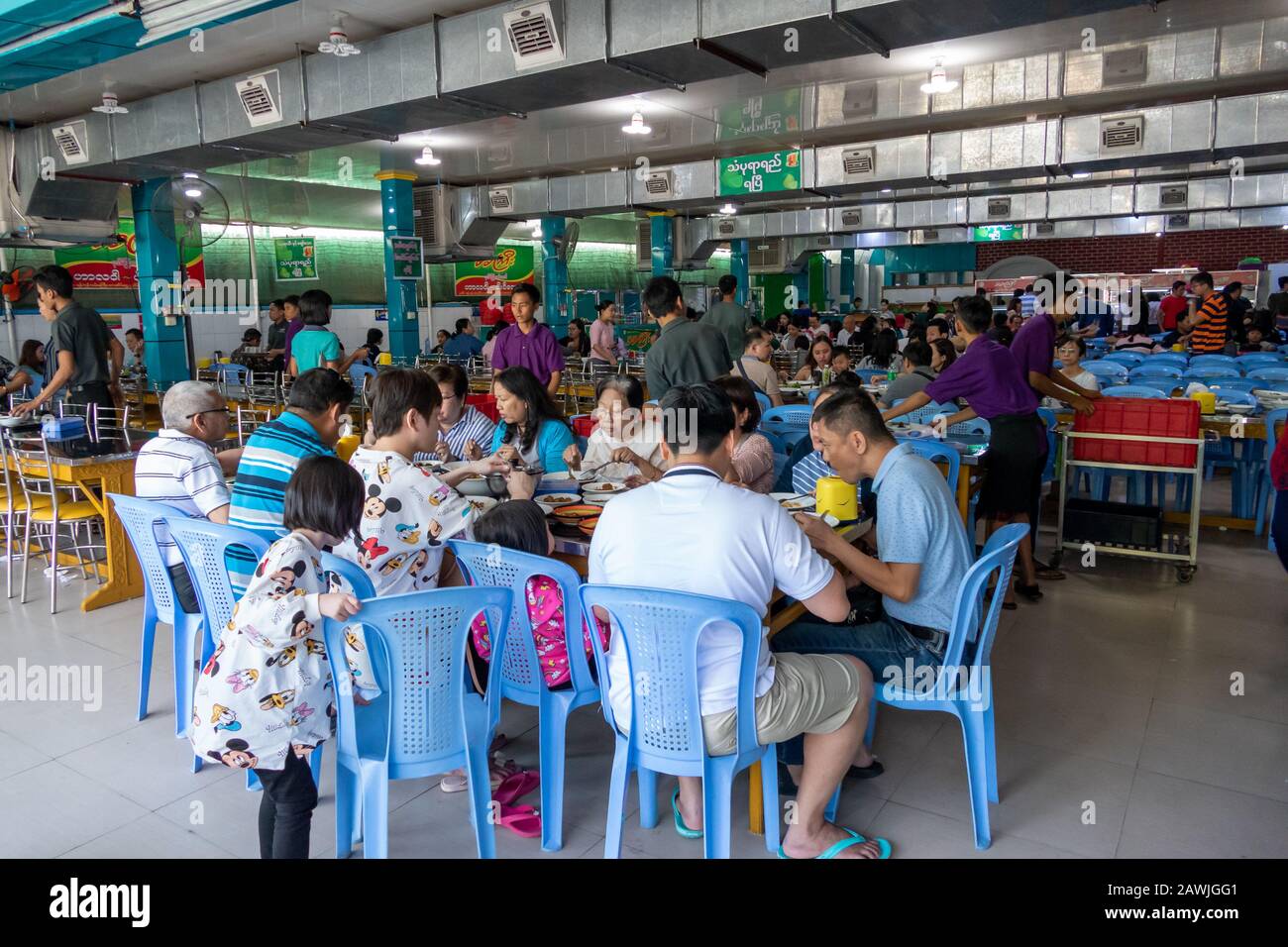 PATHEIN, MYANMAR - JANUARY 26, 2020: Unidentified people eating at a big restaurant in Pathein, the largest city and capital of Ayeyarwady Region. Stock Photo