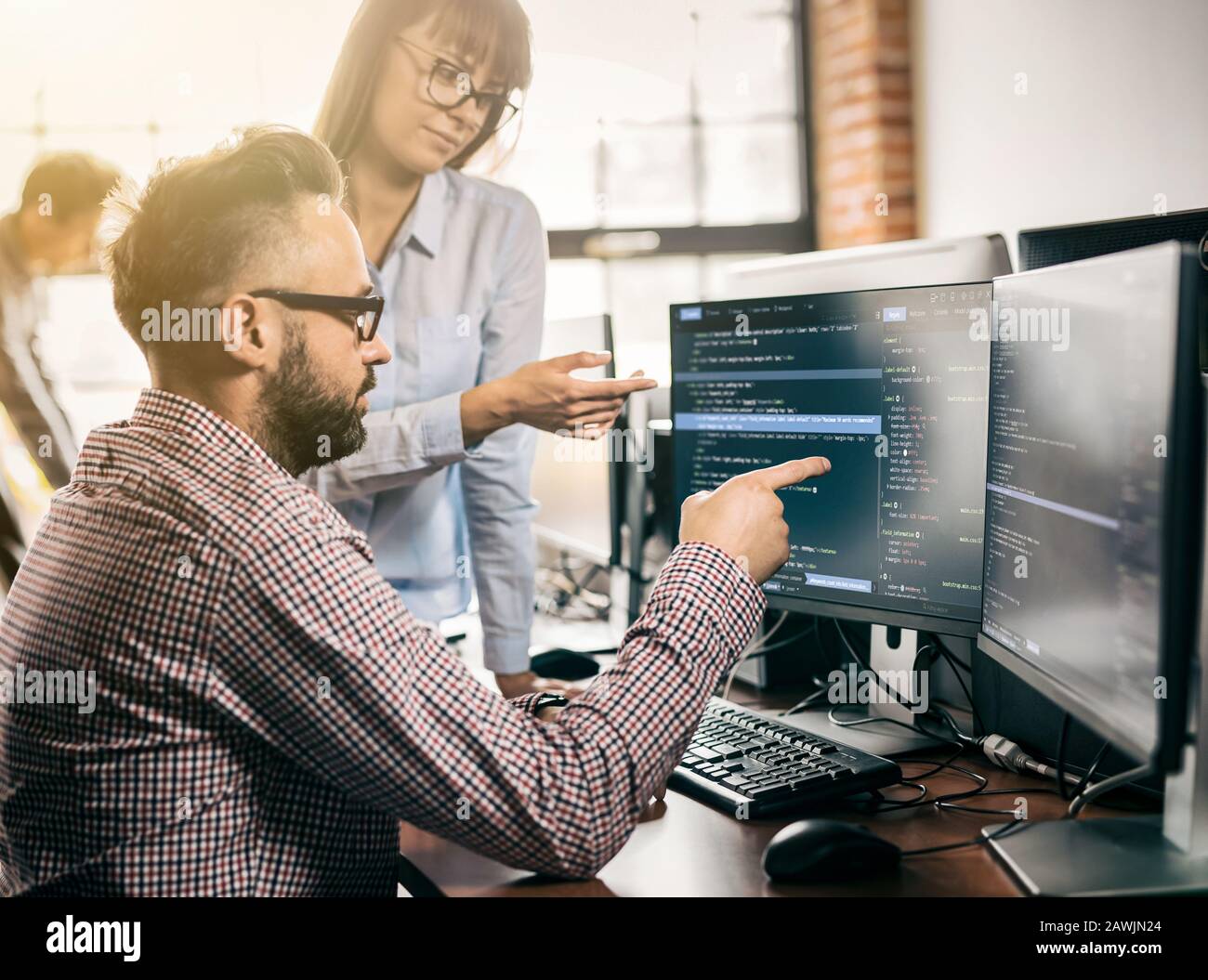 Developing programming and coding technologies. Website design. Programmer working in a software develop company office. Stock Photo