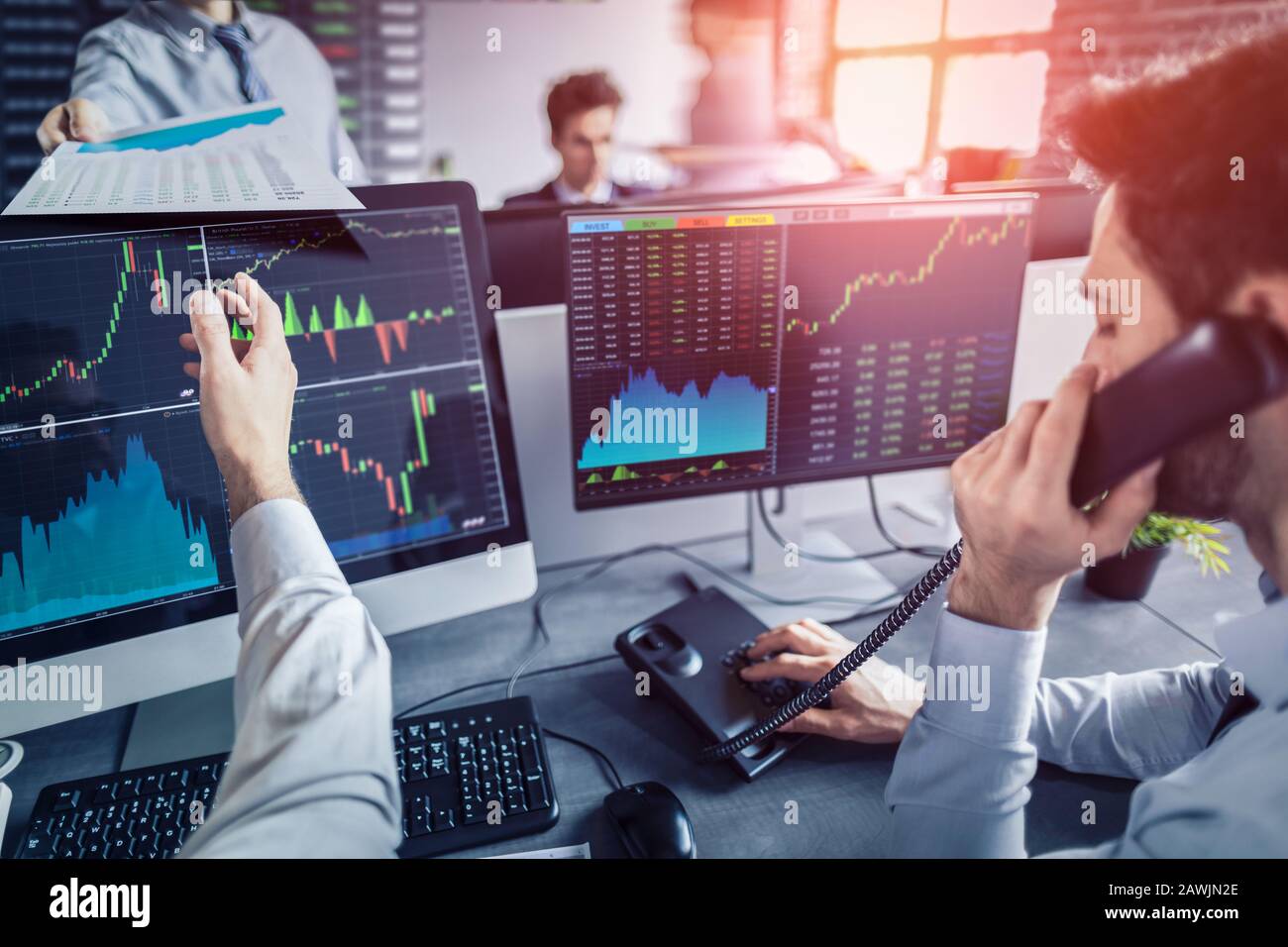 Business team investment trading do this deal on a stock exchange. People working in the office. Stock Photo
