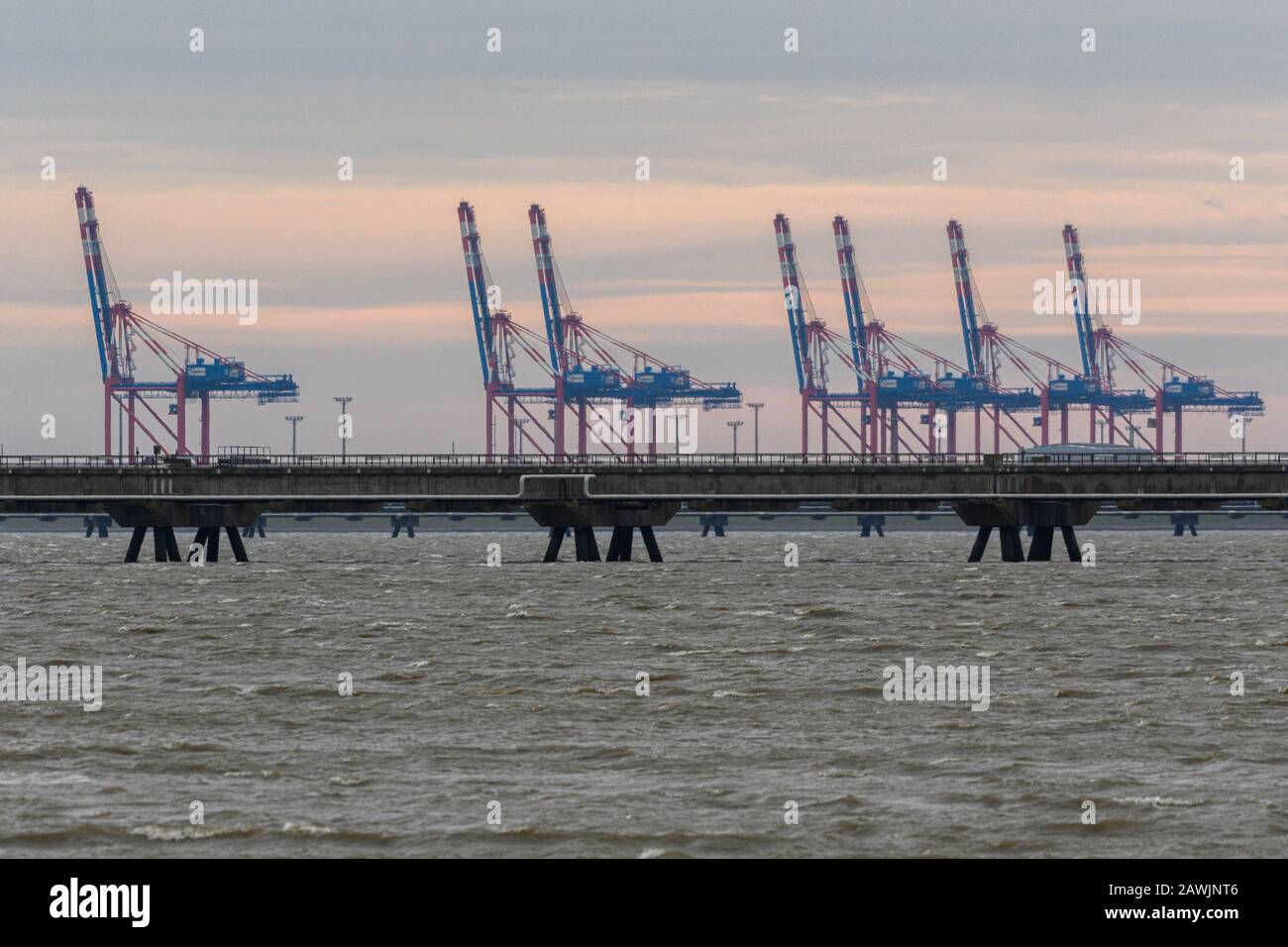 Hooksiel, Germany. 09th Feb, 2020. The cranes of the Jade Weser Port can be seen during the storm from the outer harbour of Hooksiel. Credit: Mohssen Assanimoghaddam/dpa/Alamy Live News Stock Photo