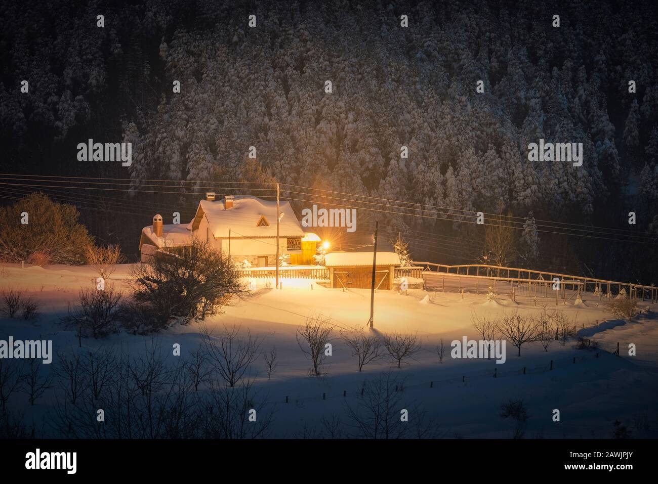 Night winter landscape. House with snow, and street lamp Stock Photo